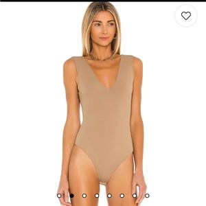 Free people size small  bodysuit. Never worn